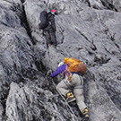Carol Masheter nearing the top of the limestone wall